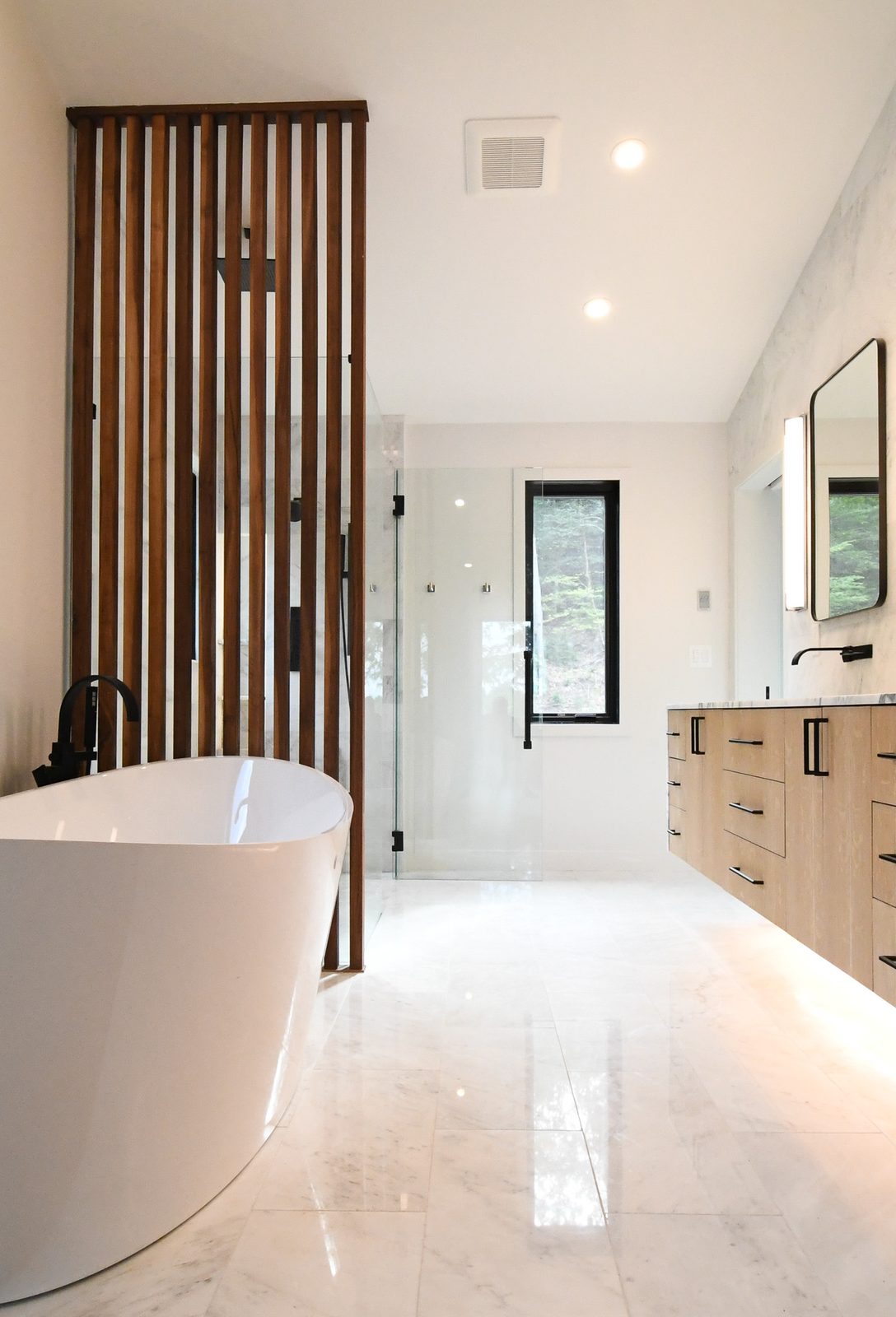 Custom wood slat feature wall and built-in millwork by TR Millwork