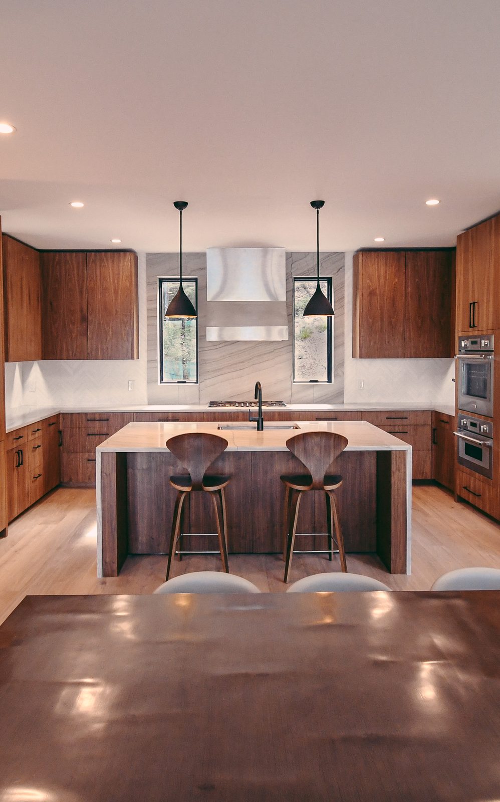Custom walnut kitchen cabinetry and island built by TR Millwork