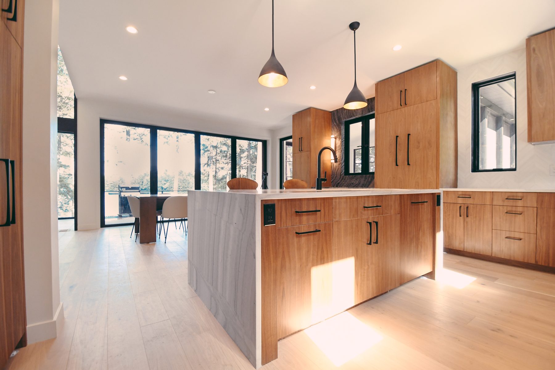 Custom walnut kitchen island and cabinetry by TR Millwork