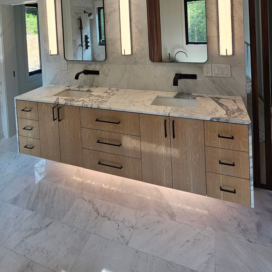 Floating white oak vanity built by T/R Millwork